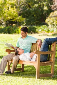 Man reading a book with his girlfriend